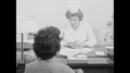 1960s: United States: Nurse Takes Medical History From Patient During