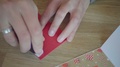 Top View Of Hands That Coat A Card With A Glue Stick
