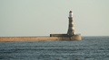Roker Lighthouse At The End Of The Pier On A Clear Sunny Day.