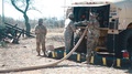 Soldier Operating Tanker Fuel Hose During Farp Operations