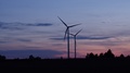 Aerial Video Of A Wind Powerplant And Windfarm In Sunset - Drone Video