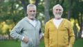Two Senior Sportsmen Smiling In Camera, Active Lifestyle, Health Care, Wellness