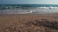 Seascape In Summer Day, View From Ground Of Pebble Beach, Human Is Swimming