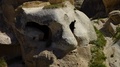 Entrances Carved Into A Rock Bolder