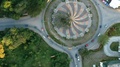 Aerial Descending View Of Traffic Entering And Exiting A Roundabout