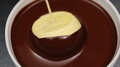 Chocolate Covered Glaze Mousse Cake On Dark Background Slow Motion