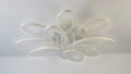 Led Chandelier In The Shape Of Petals On A White Stretch Ceiling