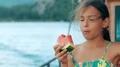 Pretty Girl Eating Watermelon During Sea Cruise. Young Girl Eating Watermelon