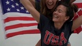 Slow Motion Of Super Smily Friends Piggybacking With Big American Flag Outdoors