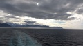 Cruise Ship Water Trace, Norwegian Sea, Background Icelands Coastline