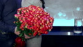Girl Holds A Hundred Pink Roses In Her Hands. A Gift From Your Beloved Grand