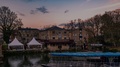 Time Lapse View Of A Riverside Pub In Oxford At Sunset With Full Moon