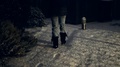 A Girl Walk In Snow Falling On Pavement Of Epsom, Surrey, Uk At Winter Night