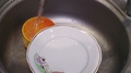 A Large Plate Is Washed In The Sink With Detergent Close Up