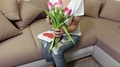 Happy Woman Holding Bouquet Of Tulips. Mothers Day Concept