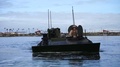 Amphibious Combat Vehicle Sailing Through Water