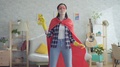 Young Woman Housewife Superhero Holding A Rag And A Spray Bottle