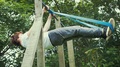Young Man Performing Front Lever Strength Training With Resistance Band