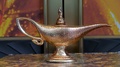 Side View Of The Antique Genie Lamp Of Disney Aladdin On A Pedestal