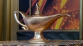 Close Up Of The Antique And Magic Gold Genie Lamp Of Disney Aladdin On A