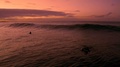 Surfer Catching Beautiful Sunset Wave At Hanalei Bay, Kauai, Hawaii.