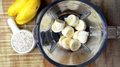 Rolled Oats Pouring In A Blender With Ripe Banana, Super Slow Motion Video.
