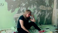 A Woman Tears Off A Wallpaper Throws A Spatula A Scraper In Despair Makes Repair