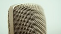 Close Up Of A Retro Styled Microphone. Camera Pans Down The Mic