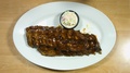 Top Steady Shot Of Bbq Ribs Steak With Side Dish
