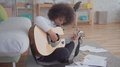 African American Woman With An Afro Hairstyle Composes A Song And Plays The