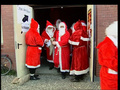 Germany: Hundreds Of Santa's Helpers Dressed In Traditional Red Robe And W.
