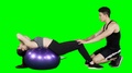 Woman Doing Sit Up Exercise On Pilates Ball