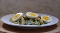 Grated Marble Cheese Sprinkled Over Pasta Salad With Spinach And Eggs.