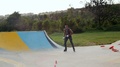 Stylish Young Boy Performing One Foot Slalom Tricks In A Park.