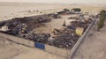 Fly Towards Scrap Yard With Excavators And Dump Trucks (4k)