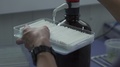Applying Fluid To Seed Papers In Laboratory