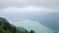 Slow Motion Shot Of Turquoise Lake Seen From High Mountain Viewpoint In