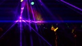 Space Laser Show. Young People Are Having Fun And Dancing In The Disco.