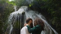 Tender Embrace Of A Young Couple On The Background Of A Waterfall In The Halo Of