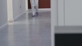 Female Dentist Legs Walking In Hallway Of Dental Clinic Office To See A