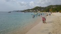 Kids Playing At Grand Anse Beach Grenada With Speed Boats In The Background