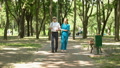 Young Nurse Holding Blind Old Patient Walking In Park, Vision Restore Clinic