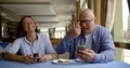 Internet Addicted Cheerful Married Couple Sitting In A Restaurant Drinking Tea