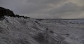 Pan Across A Snowy Landscape Under A Cloudy Sky In Thingvellir, Iceland