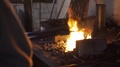Slow Motion: Aluminium Foundry Furnace Load With Metal Red Hot Flames