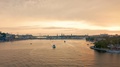 Stockholm Skyline During Sunset & Various Boats Travelling On Waterway.