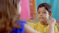 Raksha Bandhan - Little Girl Applies Tilak And Rice On Her Brother's Forehead