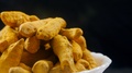 Close Up Shot Of Rotating Dried Turmeric Roots With Black Background
