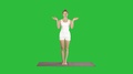 Young Yoga Woman Meditating Standing On A Green Screen, Chroma Key.