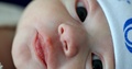 Newborn Baby Face Close-Up Details Of Eyes Nose And Mouth In First Minutes Of